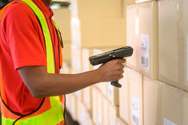 Eco-Oryx technician scanning tagged boxes with a handheld RFID reader